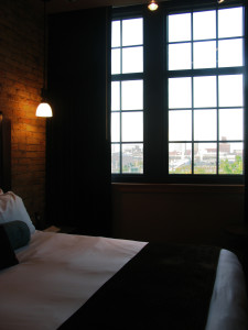 Guest rooms have original art and deluxe bathrooms; some come with a city view