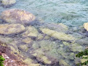 The Lake Superior water is incredibly clear; these boulders, viewed from a high cliff, are monstrous