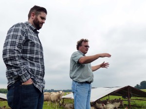 Chef Robb Hammond (left) listens as Norm Carlson talks about the pastured chickens his Carlson Farms provides to Food Dance