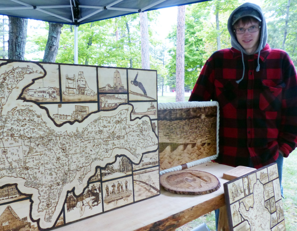 Aaren Joki and some of his creations. Yes, it was that cold at Midsummer in Marquette . 