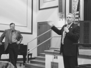 Cloverland CEO Dan Dasho (left) gave the microphone to State Representative John Kivela at the community meeting in Newberry