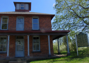 An historic marker stands outside the "Bishop Baraga House" in Marquette; the home has been modified since he died there 145 years ago today